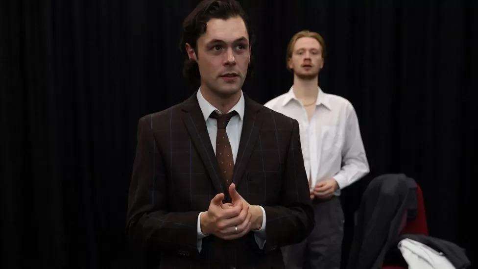 Image is of actors Jordan Tweddle (left) and George Miller (right) in the performance held at the New Adelphi Theatre in November 2022
