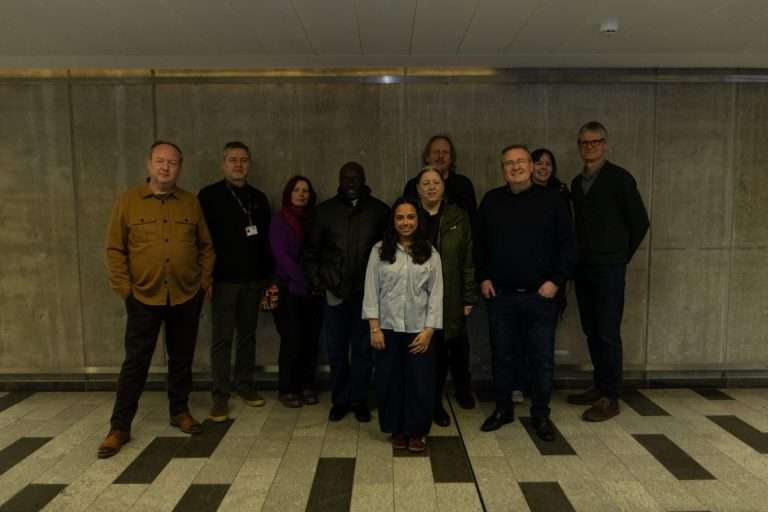 Fowziyah Adam (centre) with the Salford City Council panel and BA Graphic Design programme lead Alan Oliver (far left) at the New Adelphi Building, Salford. Credit: Paige Brierley