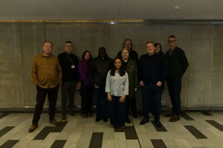 Fowziyah Adam (centre) with the Salford City Council panel and BA Graphic Design programme lead Alan Oliver (far left) at the New Adelphi Building, Salford. Credit: Paige Brierley