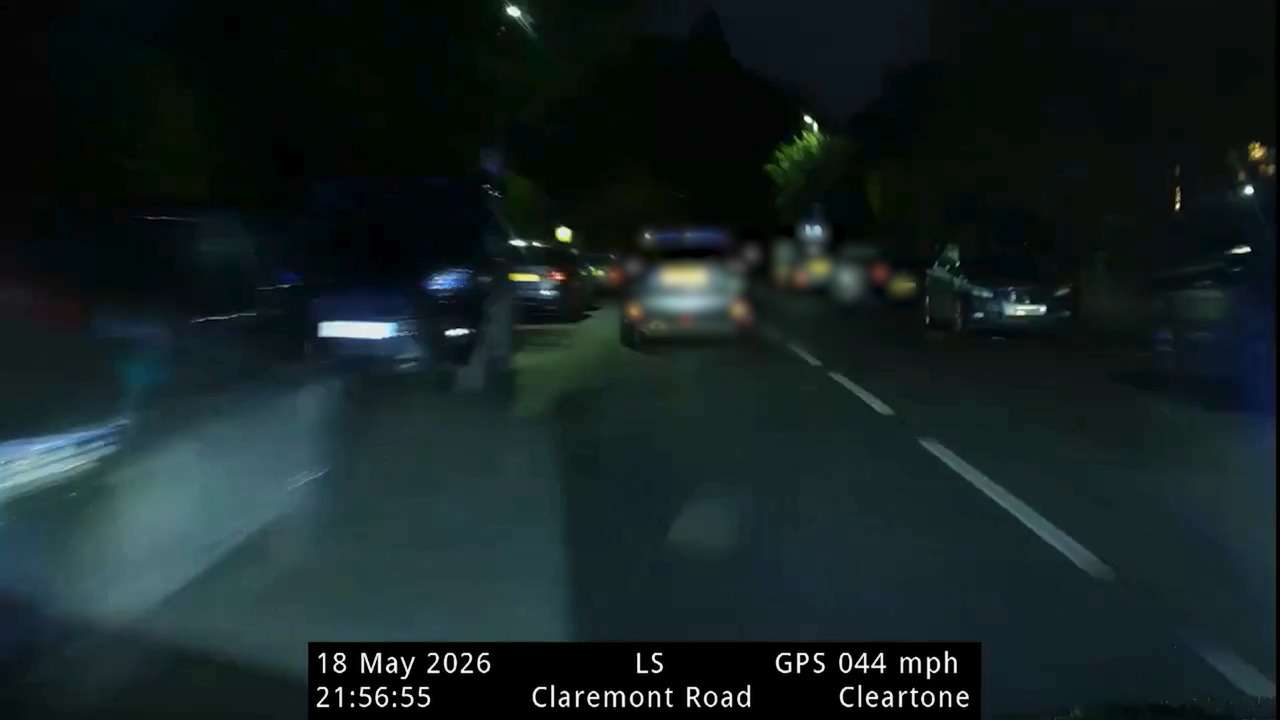 Dashcam view at night on Claremont Road with blurry oncoming cars; on-screen data shows date 18 May 2026, time 21:56:55, GPS speed 044 mph, location Cleartone/Claremont Road.
